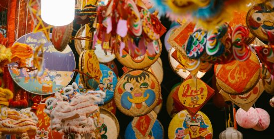 Colorful lanterns and traditional decorations at a Mid-Autumn Festival market.